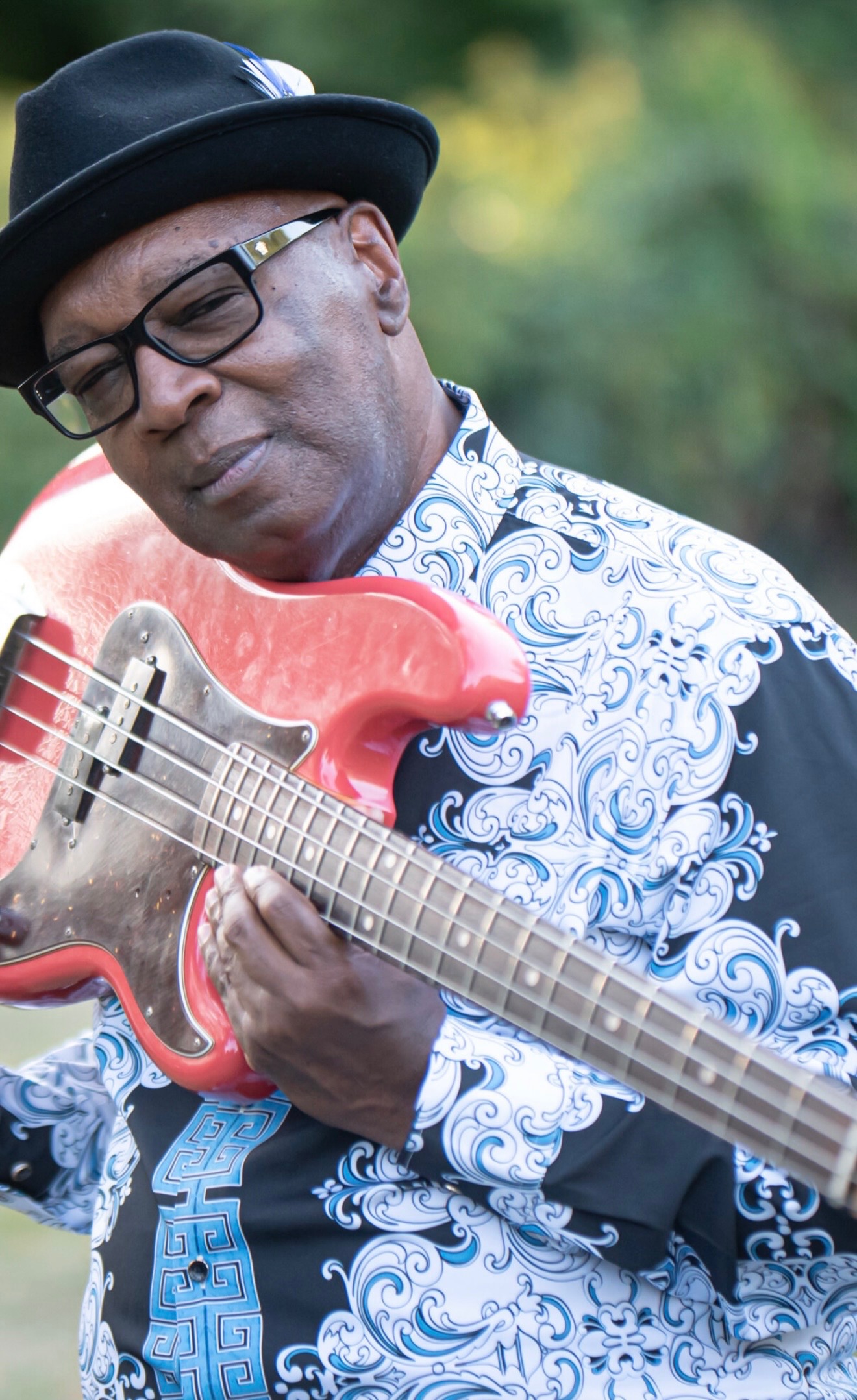 George Moye outdoors with his red bass